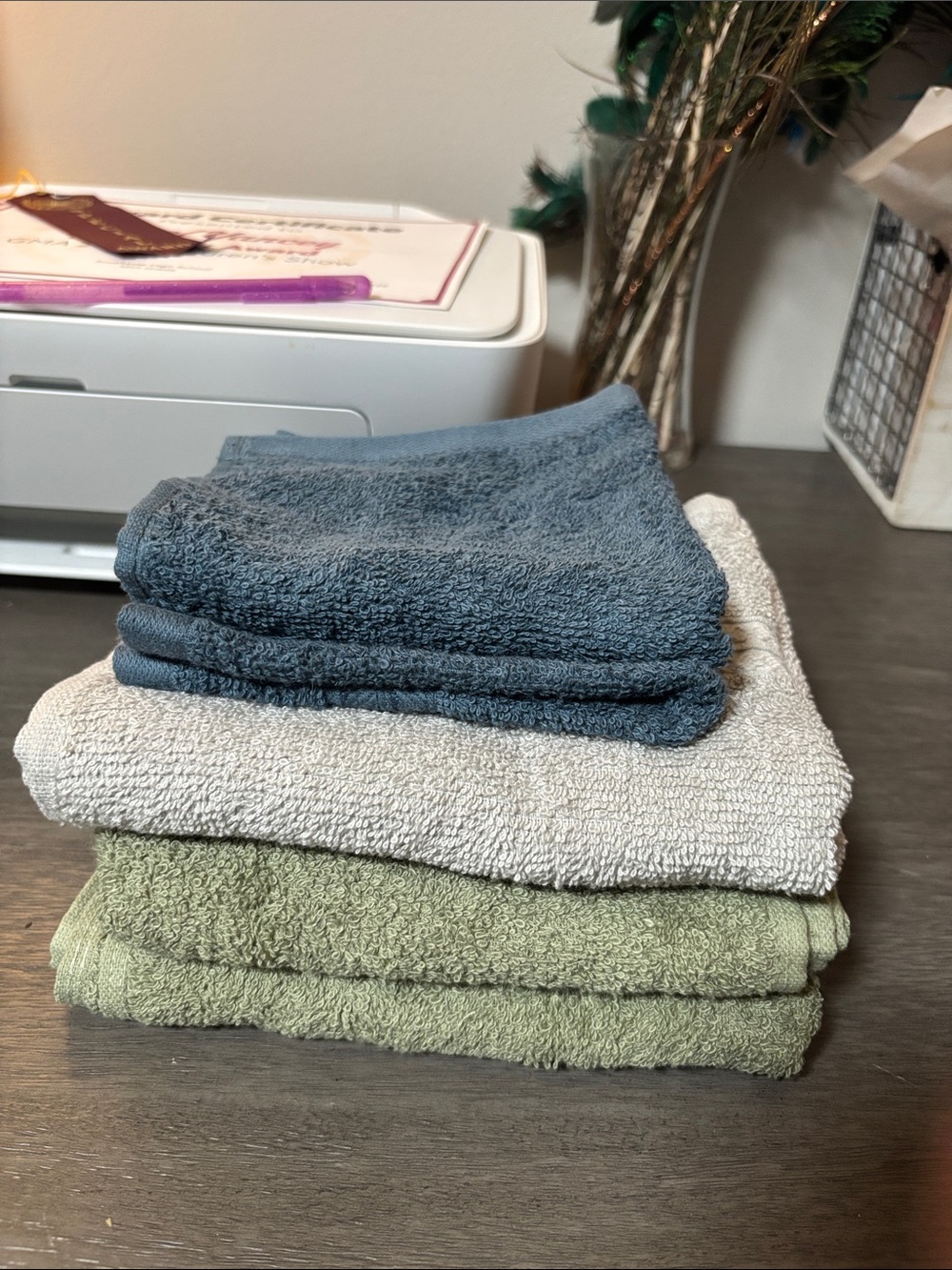 Stack of Soft Hand Towels in Blue, Light Gray, and Sage Green